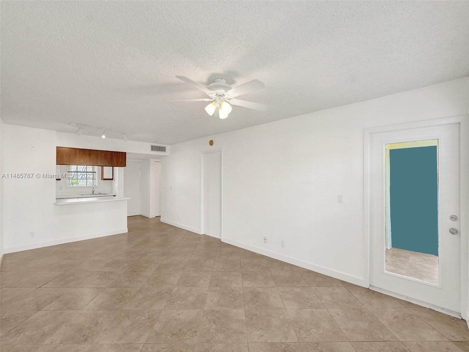 6339 La Costa Drive, Unit C Boca Raton, FL 33433 - Photo 7 of 23 an empty room with a bathroom and a ceiling fan