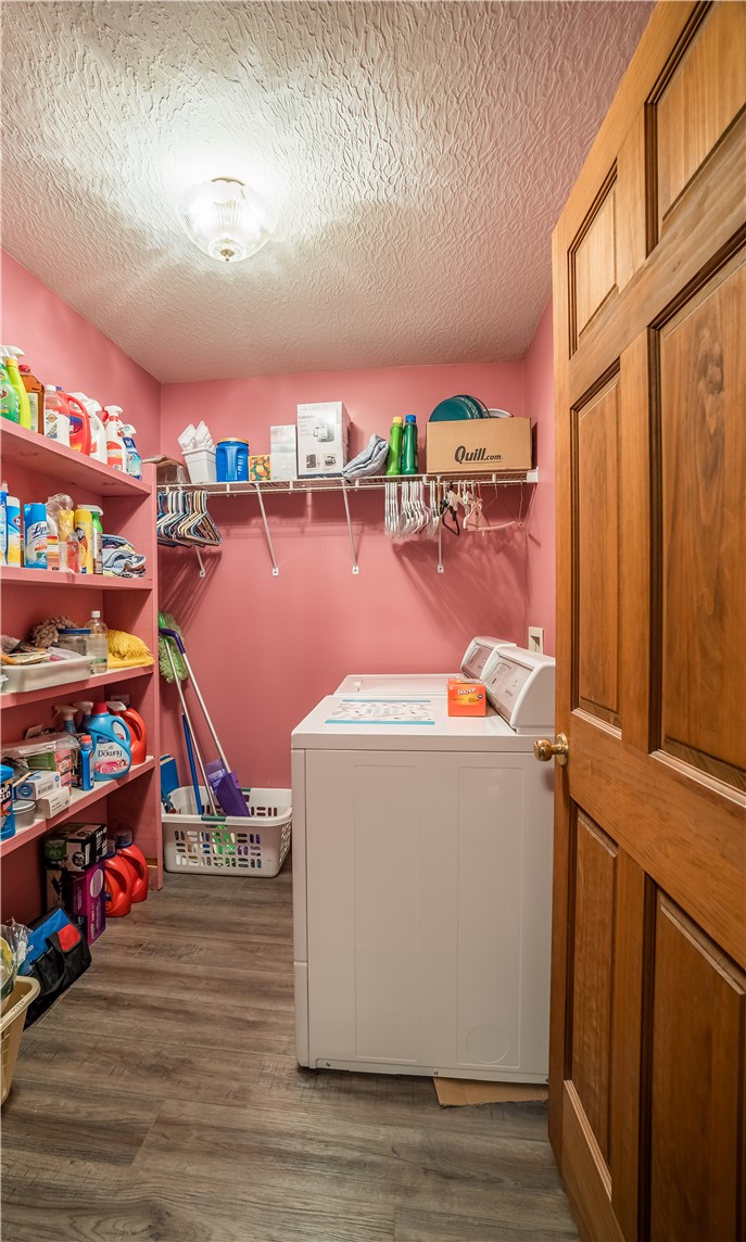 1319 Perry Road Cable, OH 43009 - Photo 17 of 44 This functional laundry room features convenient storage and durable flooring.