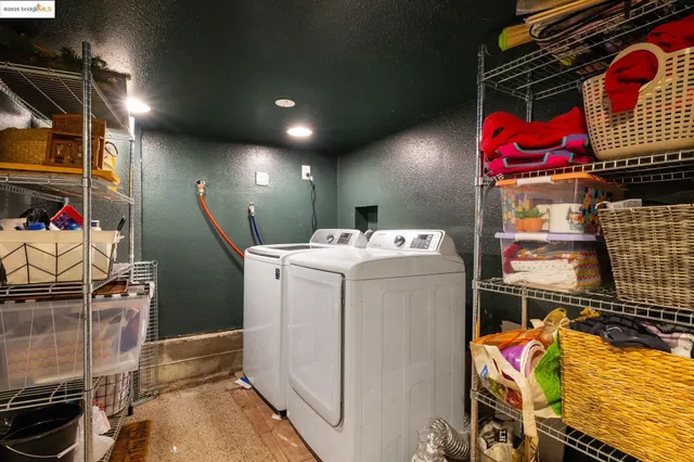 a bedroom with furniture and a stairs