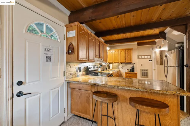 a kitchen with stainless steel appliances granite countertop a sink and cabinets