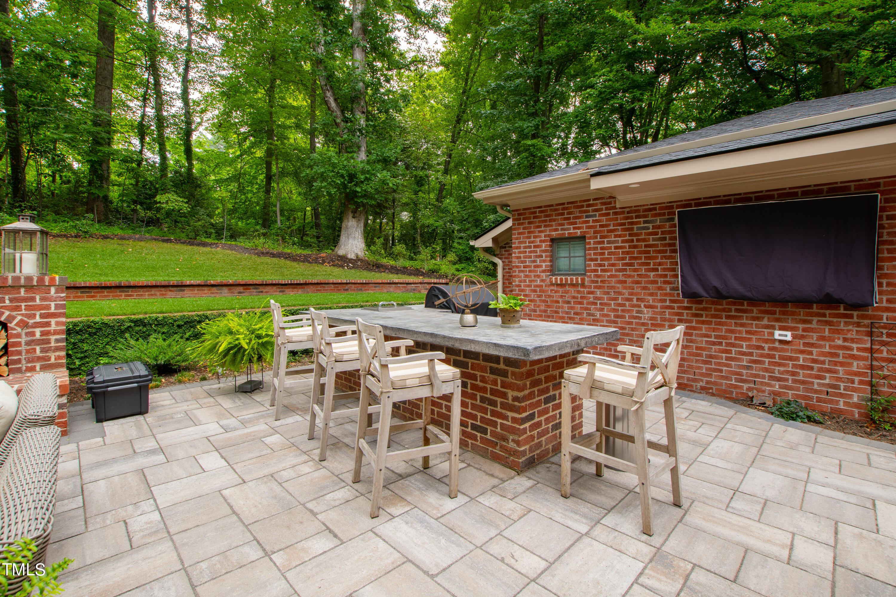 612 Marlowe Road Raleigh, NC 27609 - Photo 15 of 60 a backyard of a house with dining table and chairs