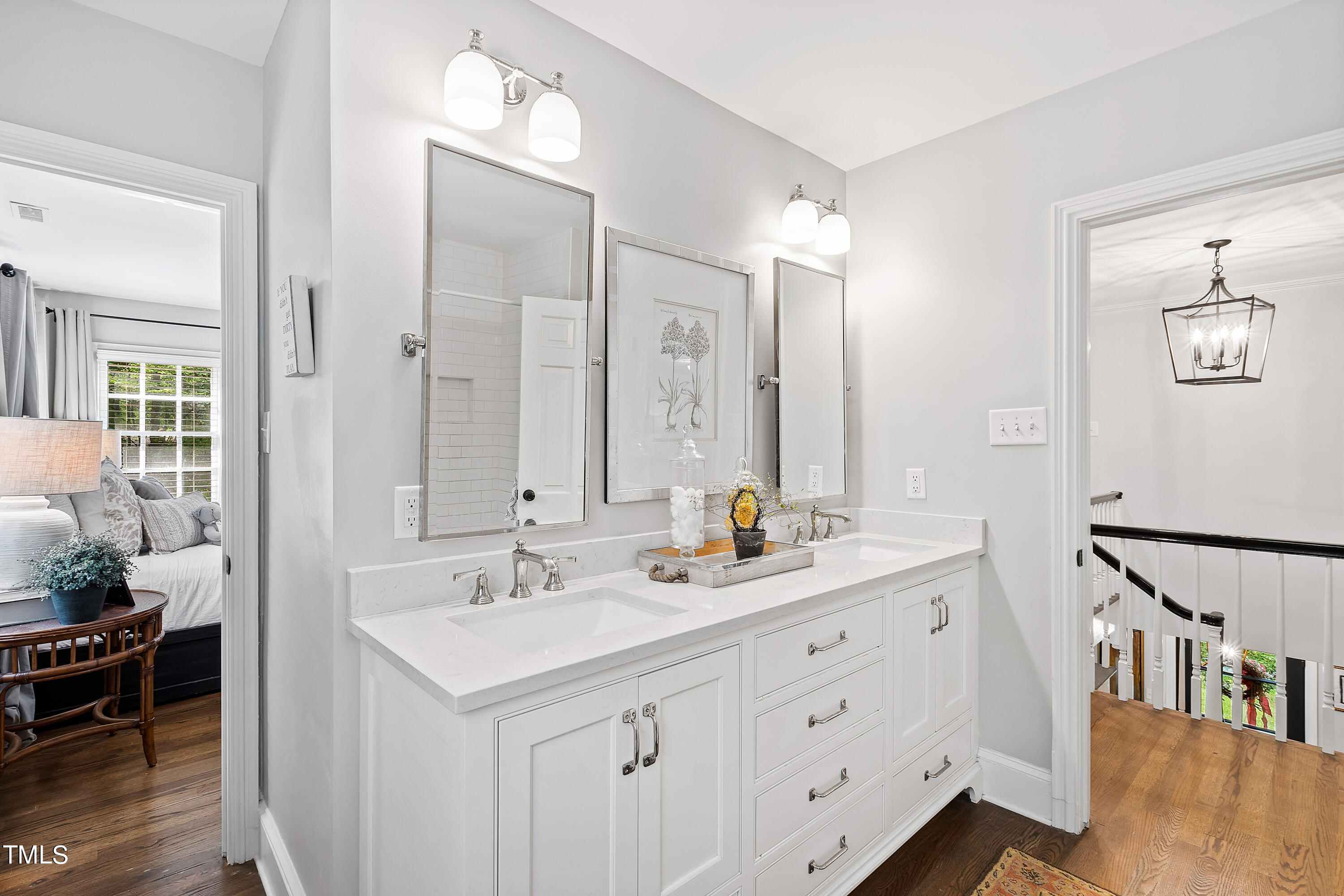 612 Marlowe Road Raleigh, NC 27609 - Photo 19 of 60 a bathroom with double vanity sink and a mirror