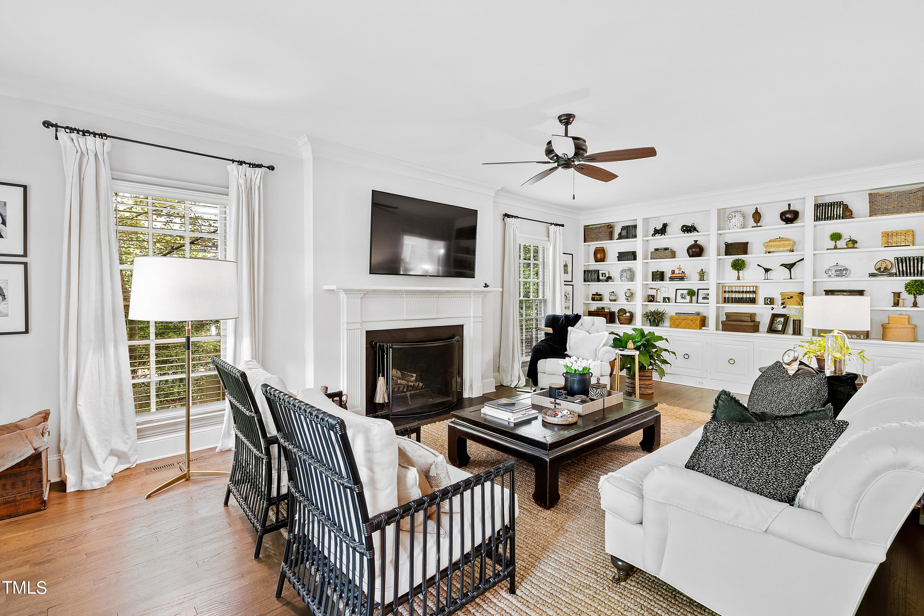 612 Marlowe Road Raleigh, NC 27609 - Photo 2 of 60 a living room with furniture a flat screen tv and a fireplace