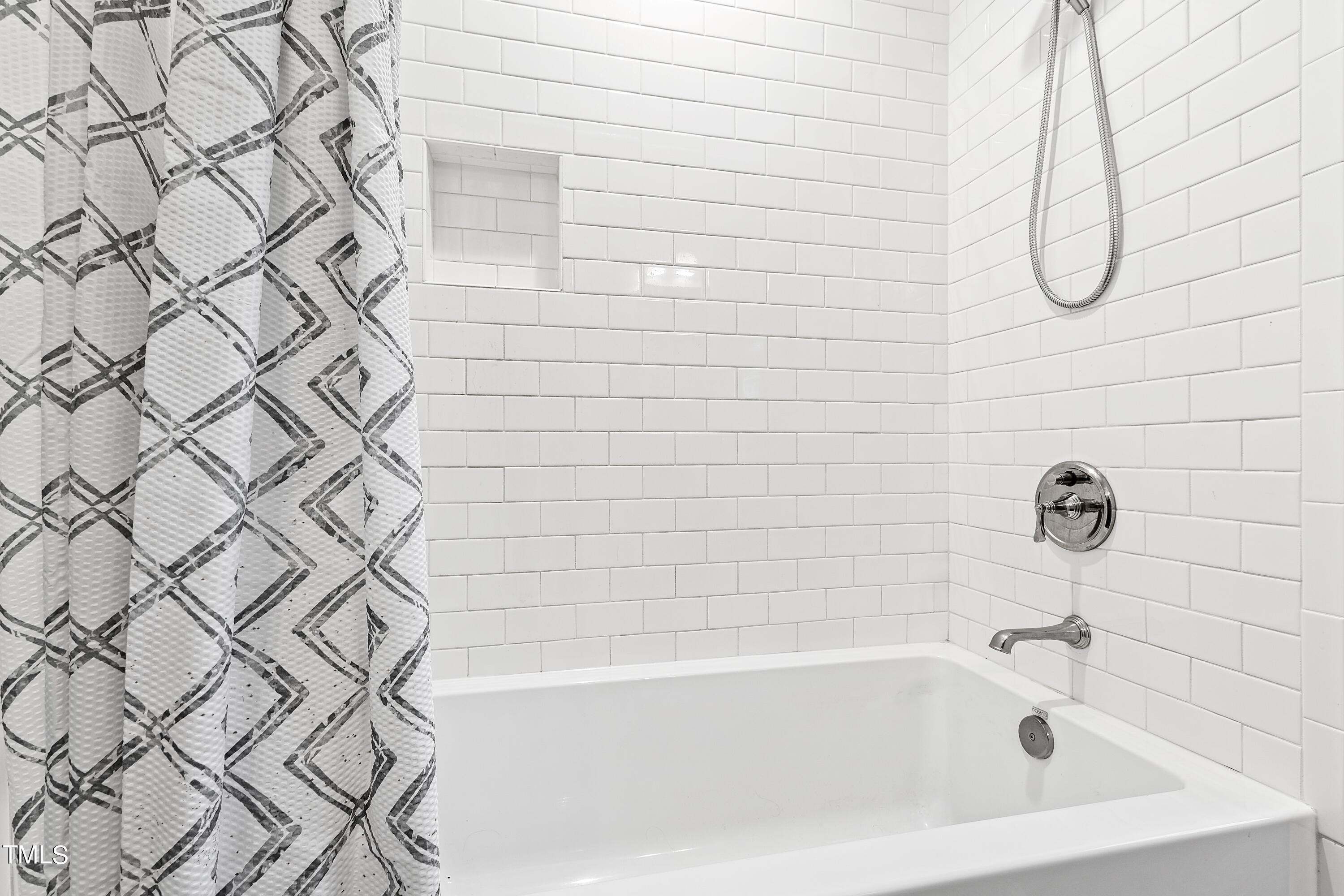 612 Marlowe Road Raleigh, NC 27609 - Photo 21 of 60 a bathroom with a bathtub and shower