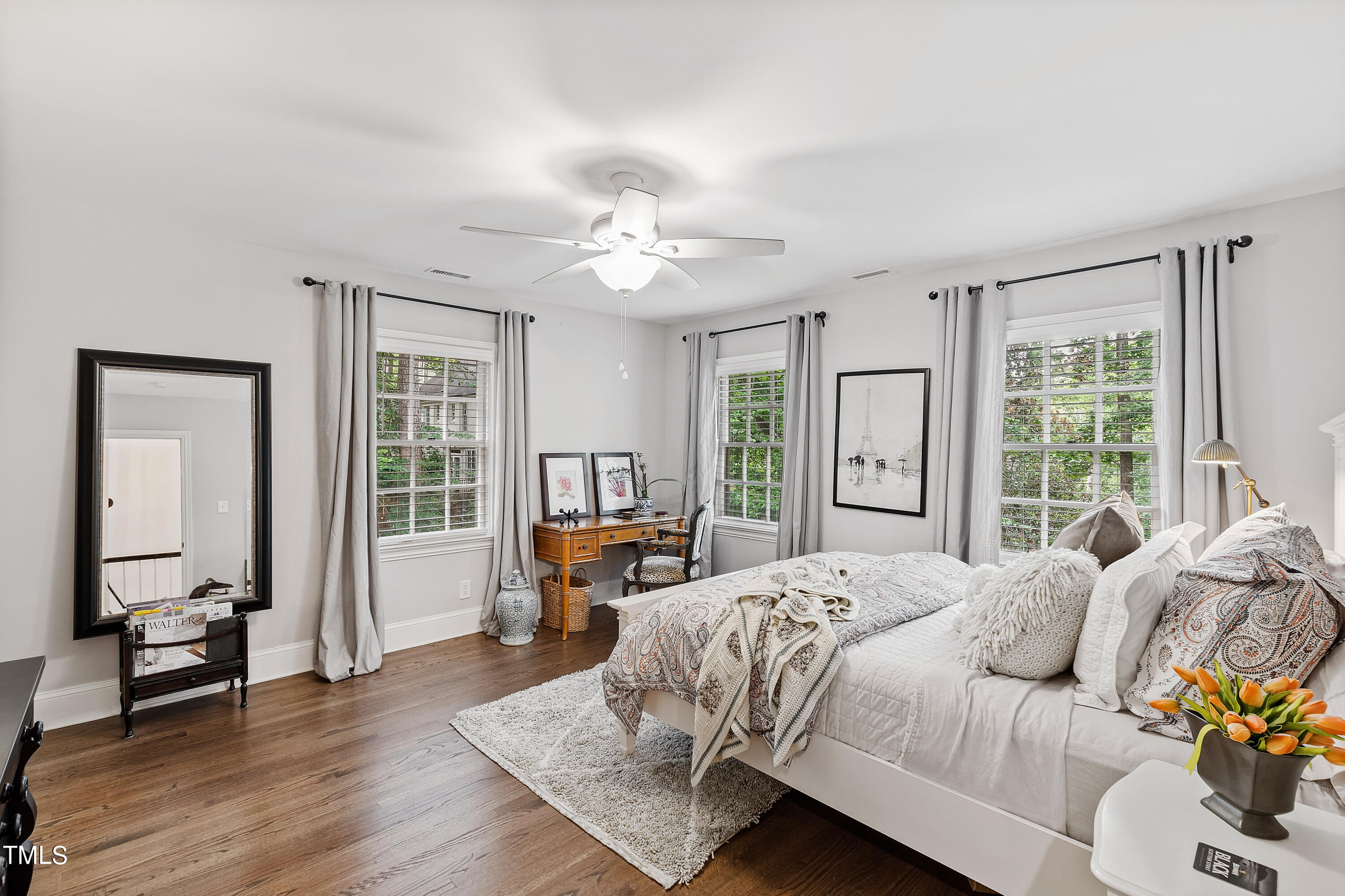 612 Marlowe Road Raleigh, NC 27609 - Photo 26 of 60 a bedroom with a bed couch and a large window with wooden floor