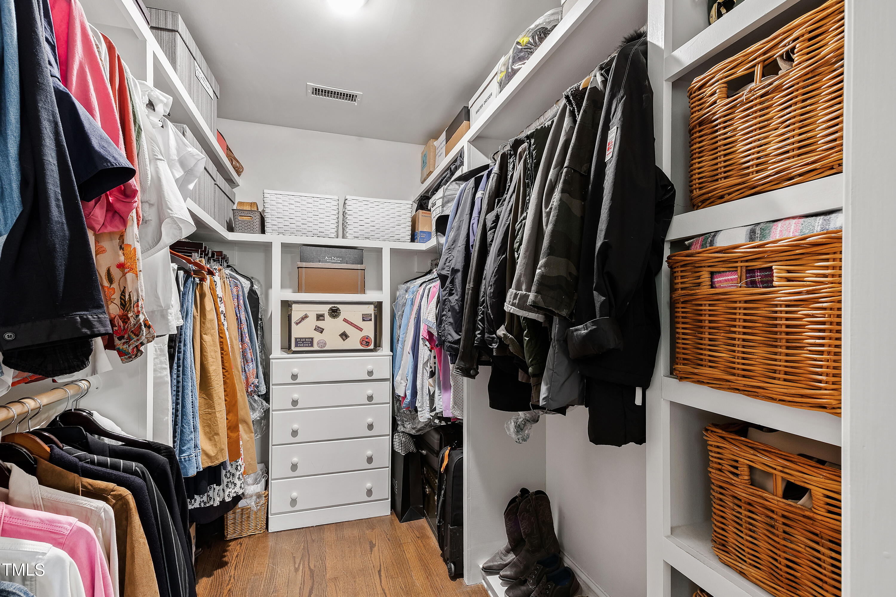 612 Marlowe Road Raleigh, NC 27609 - Photo 32 of 60 a view of walk in closet with clothes and shoes