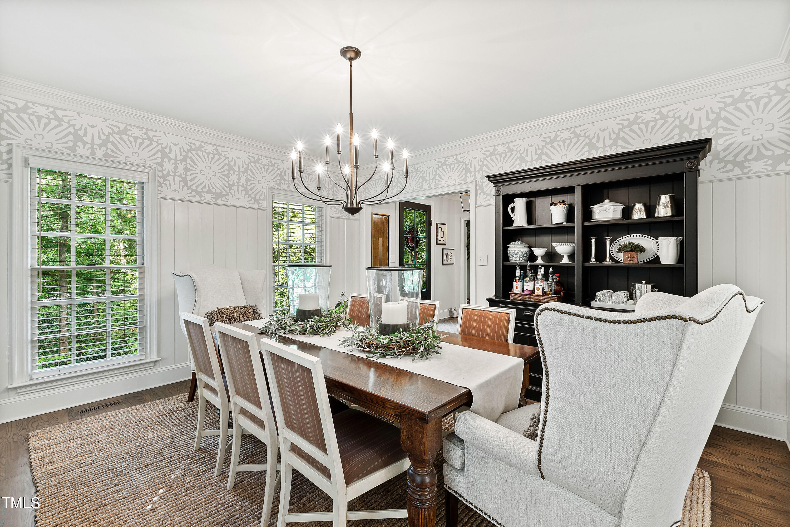 612 Marlowe Road Raleigh, NC 27609 - Photo 33 of 60 a view of a dining room with furniture wooden floor and chandelier