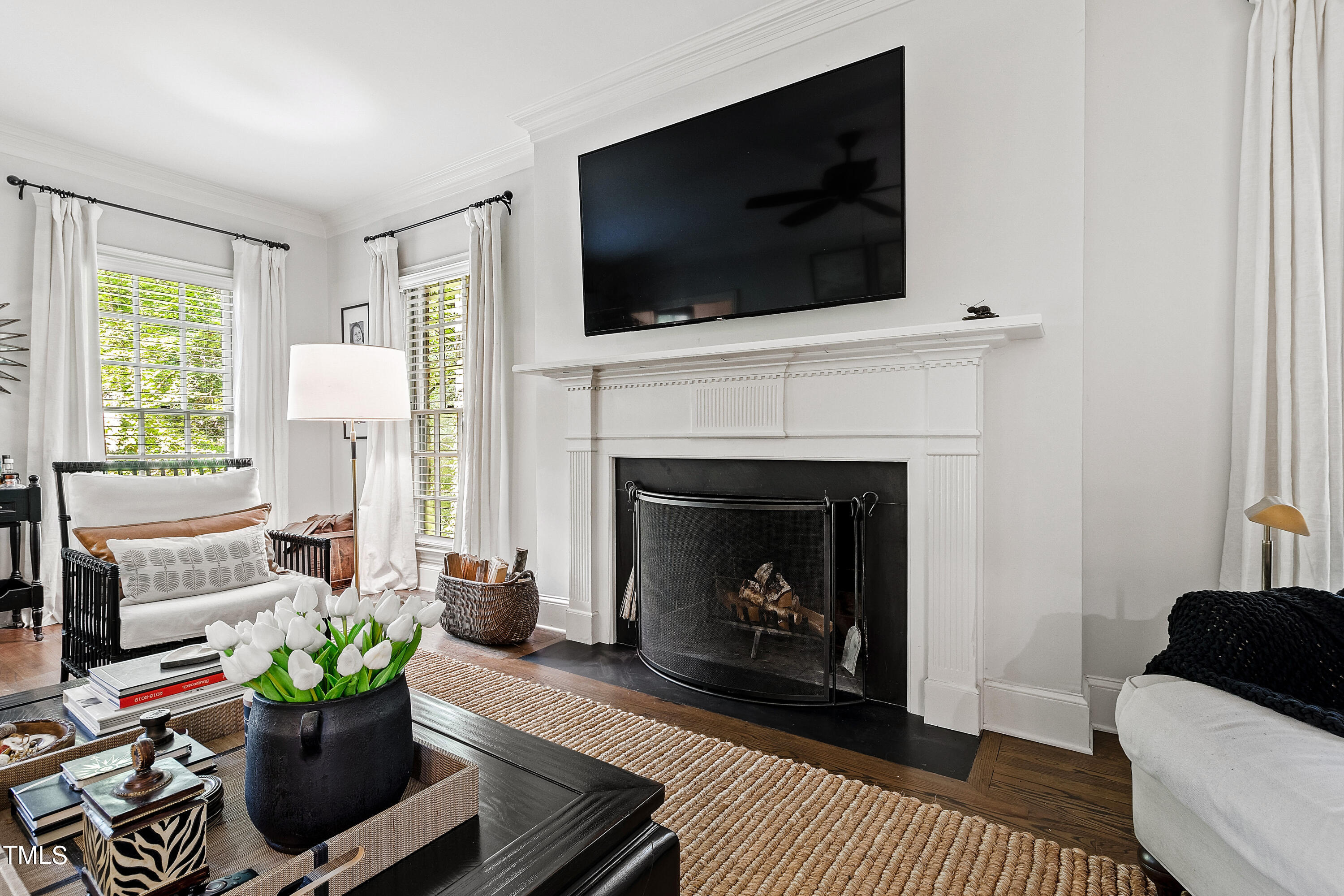 612 Marlowe Road Raleigh, NC 27609 - Photo 39 of 60 a living room with furniture a flat screen tv and a fireplace