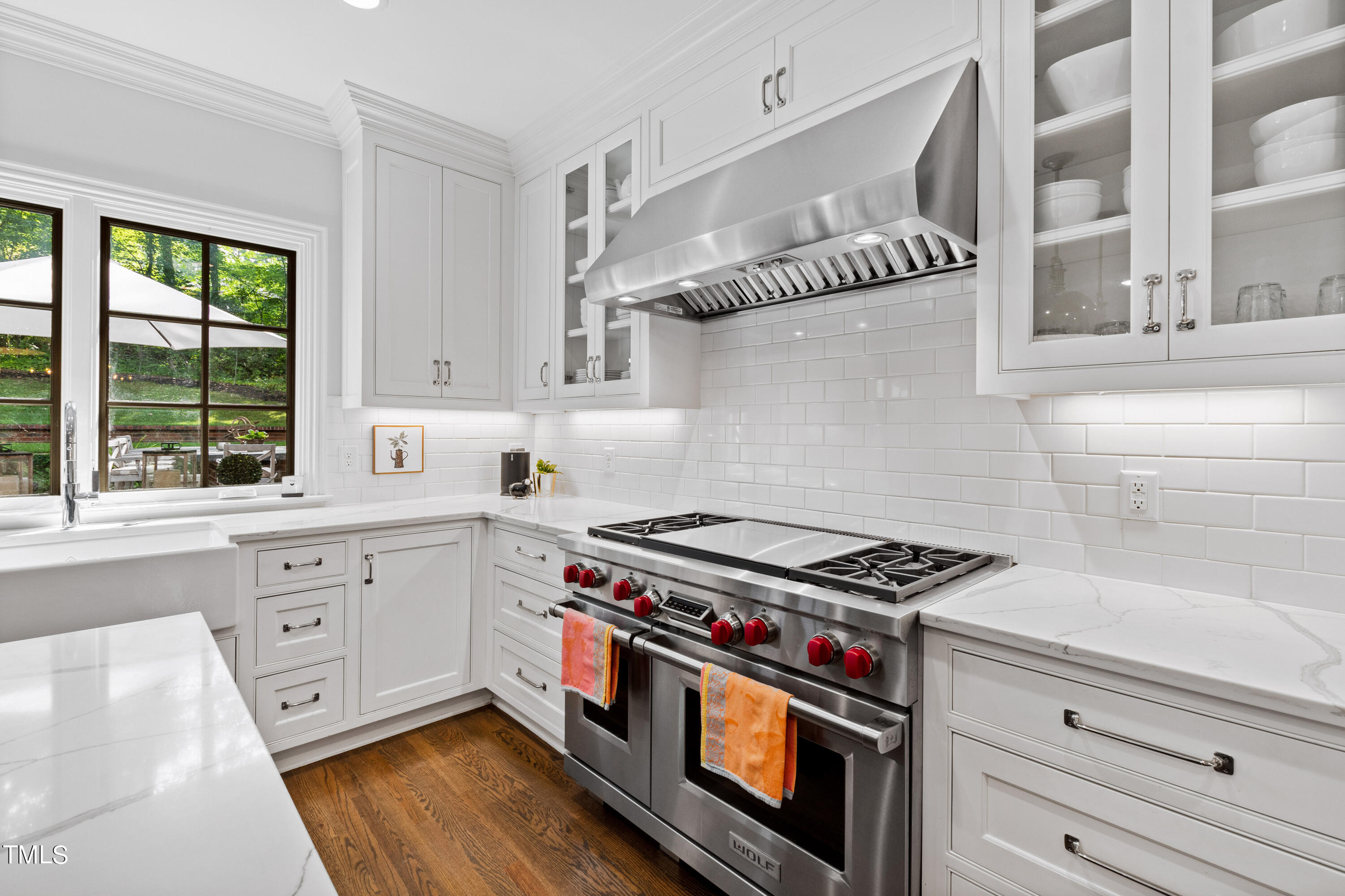 612 Marlowe Road Raleigh, NC 27609 - Photo 50 of 60 a kitchen with cabinets appliances and a window