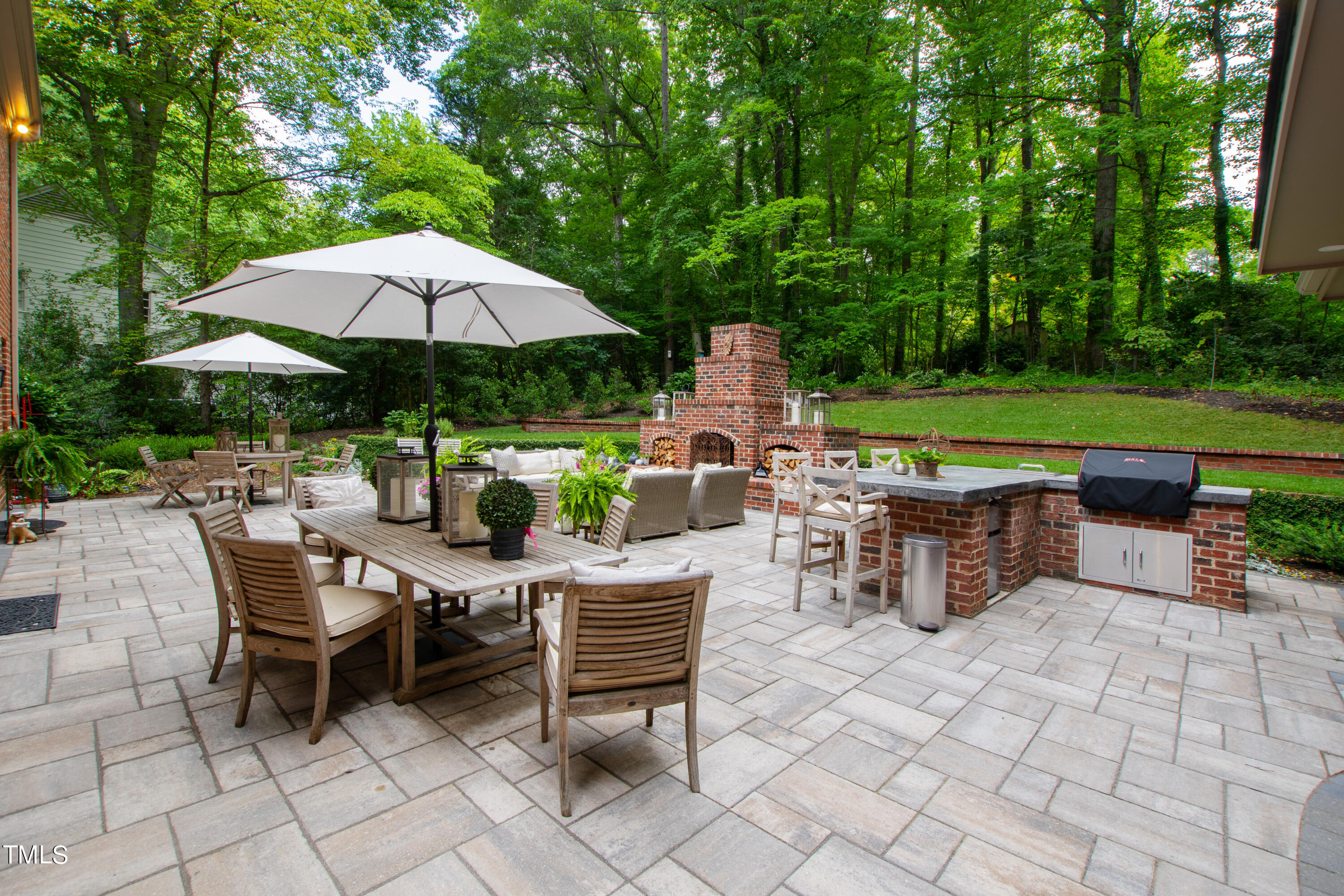 612 Marlowe Road Raleigh, NC 27609 - Photo 52 of 60 an outdoor space with furniture and umbrella