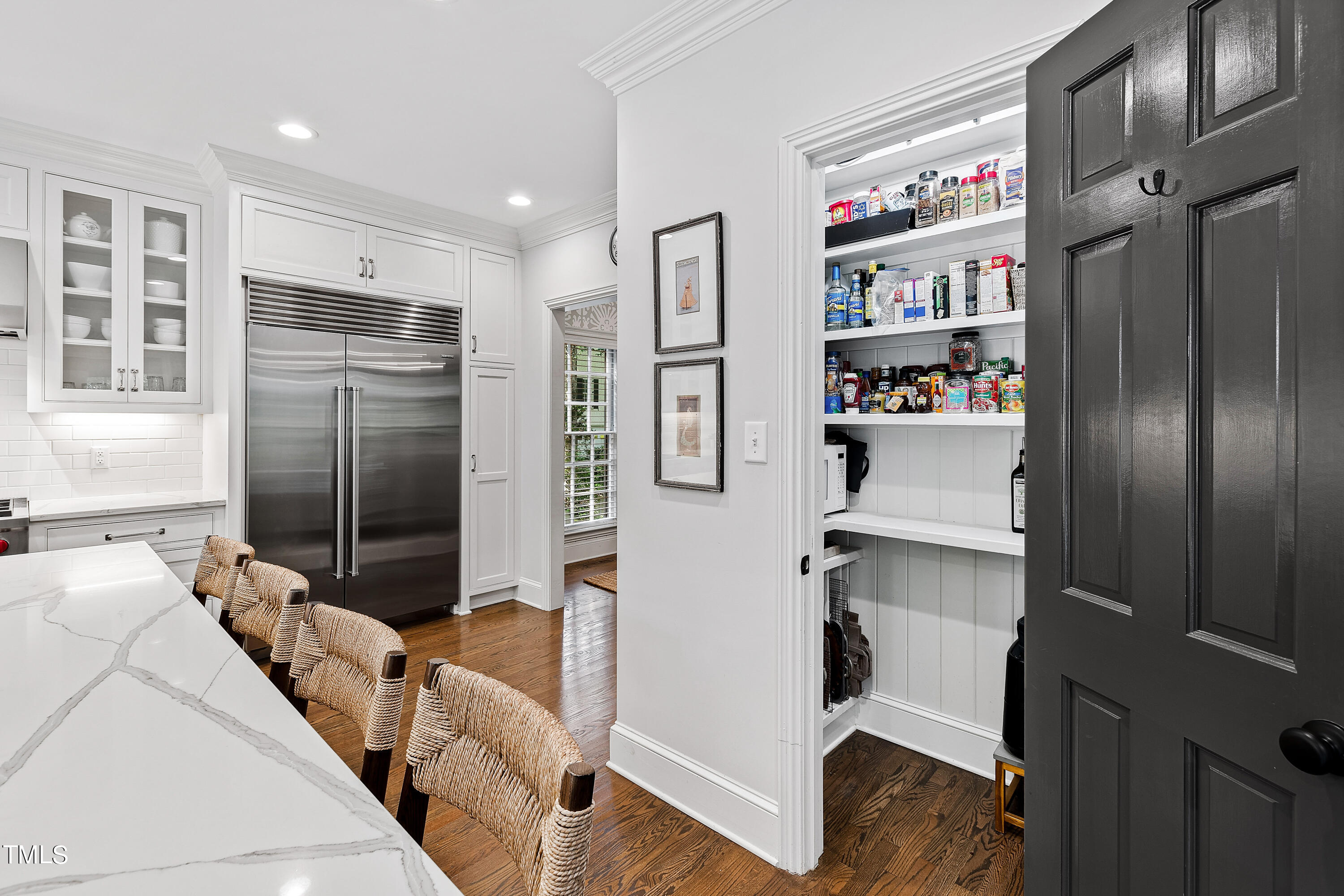 612 Marlowe Road Raleigh, NC 27609 - Photo 56 of 60 a kitchen with stainless steel appliances granite countertop a refrigerator and a sink