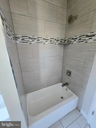 a bathroom with a bath tub