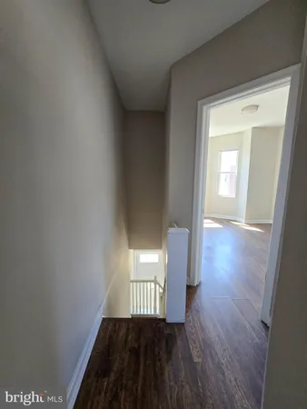 a view of gallery with wooden floor