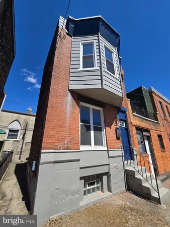a front view of a house with a balcony