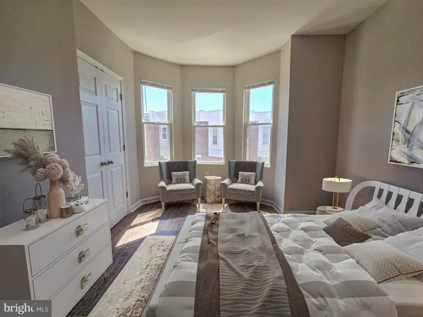 a bedroom with furniture and a window