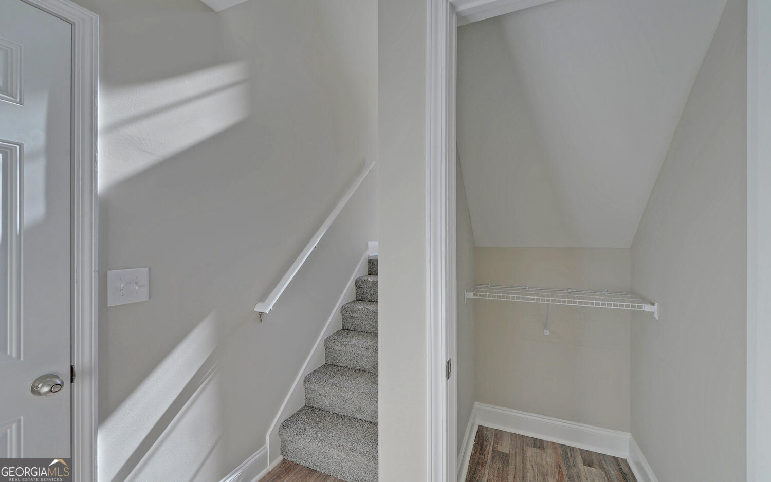 2994 Cannon Bridge Road Demorest, GA 30535 - Photo 23 of 36 a view of staircase with white walls and empty racks