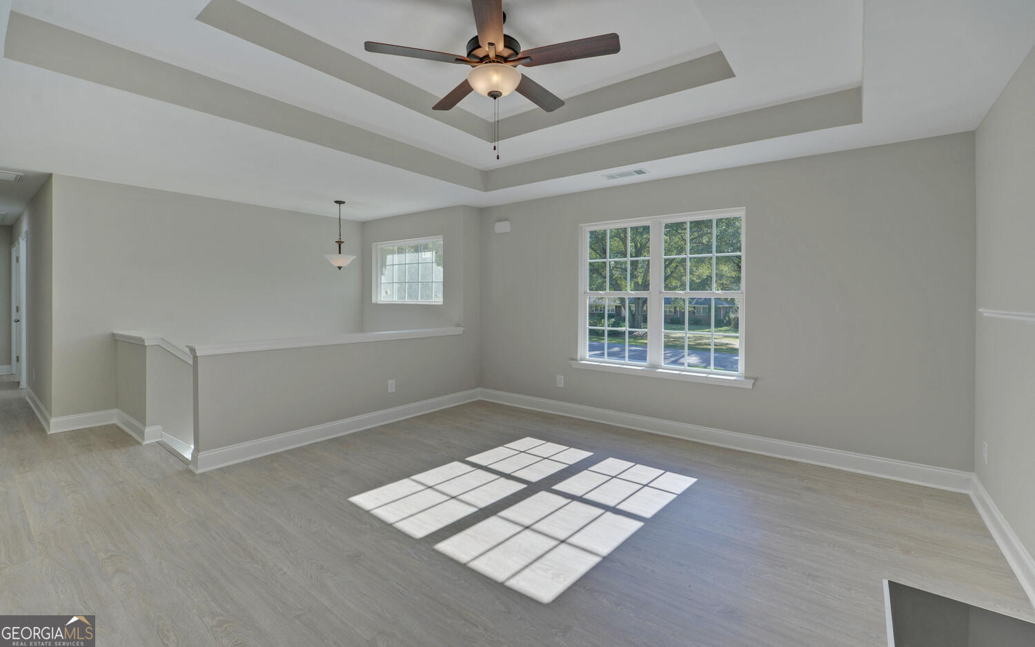 2994 Cannon Bridge Road Demorest, GA 30535 - Photo 4 of 36 an empty room with windows and ceiling fan