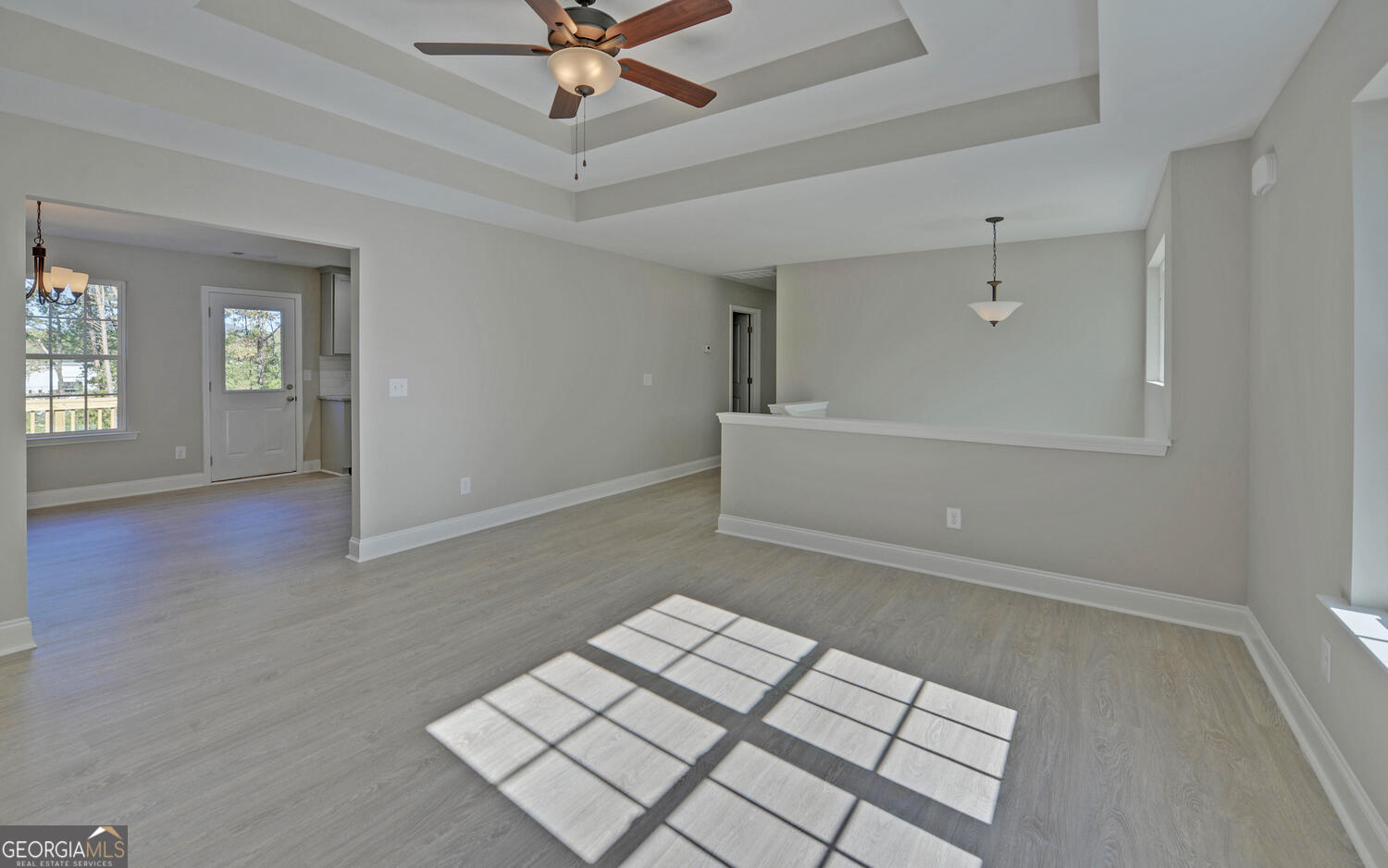 2994 Cannon Bridge Road Demorest, GA 30535 - Photo 5 of 36 an empty room with windows and fan