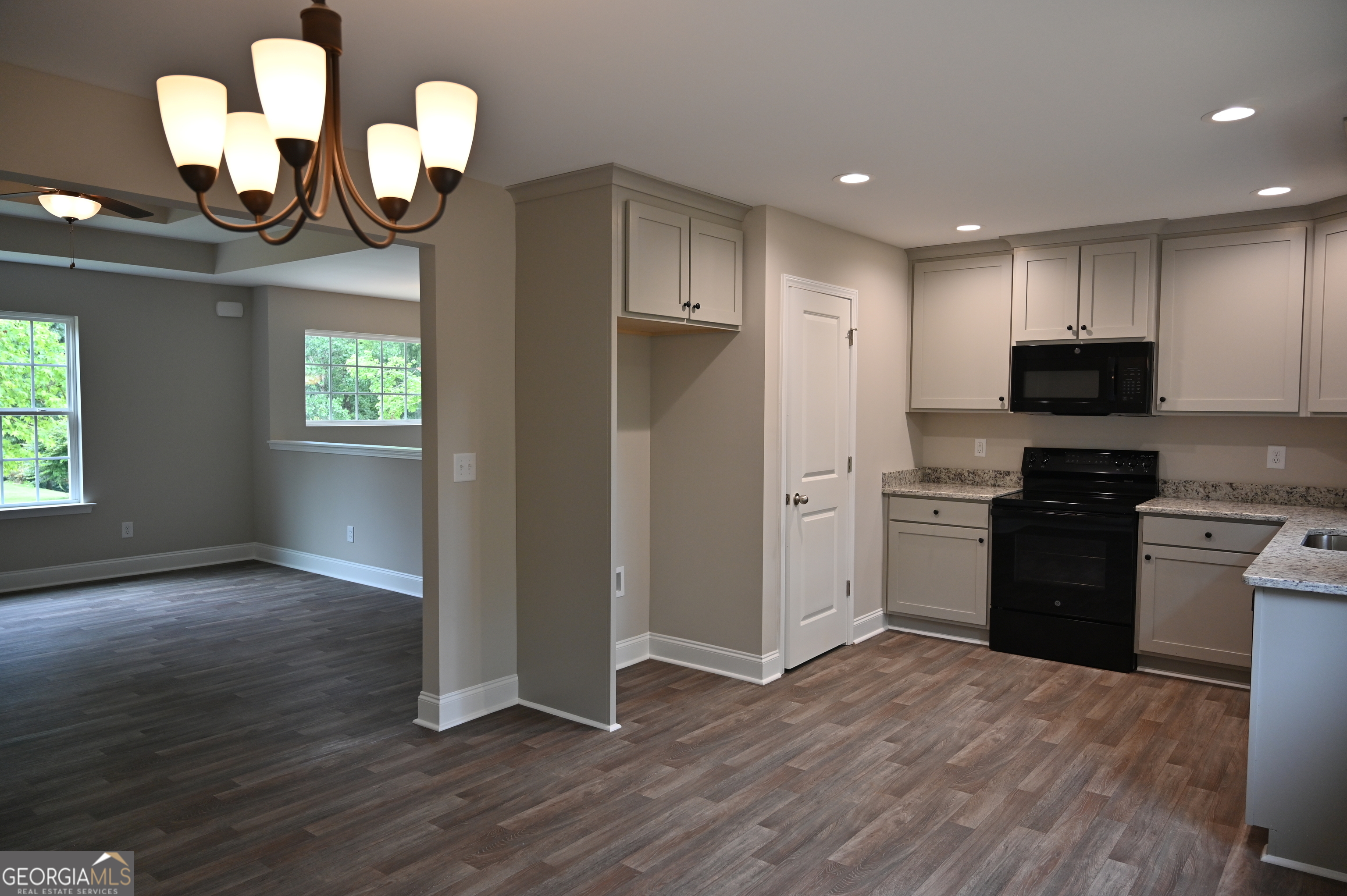 2994 Cannon Bridge Road Demorest, GA 30535 - Photo 8 of 36 a kitchen with stainless steel appliances granite countertop a refrigerator and a stove top oven