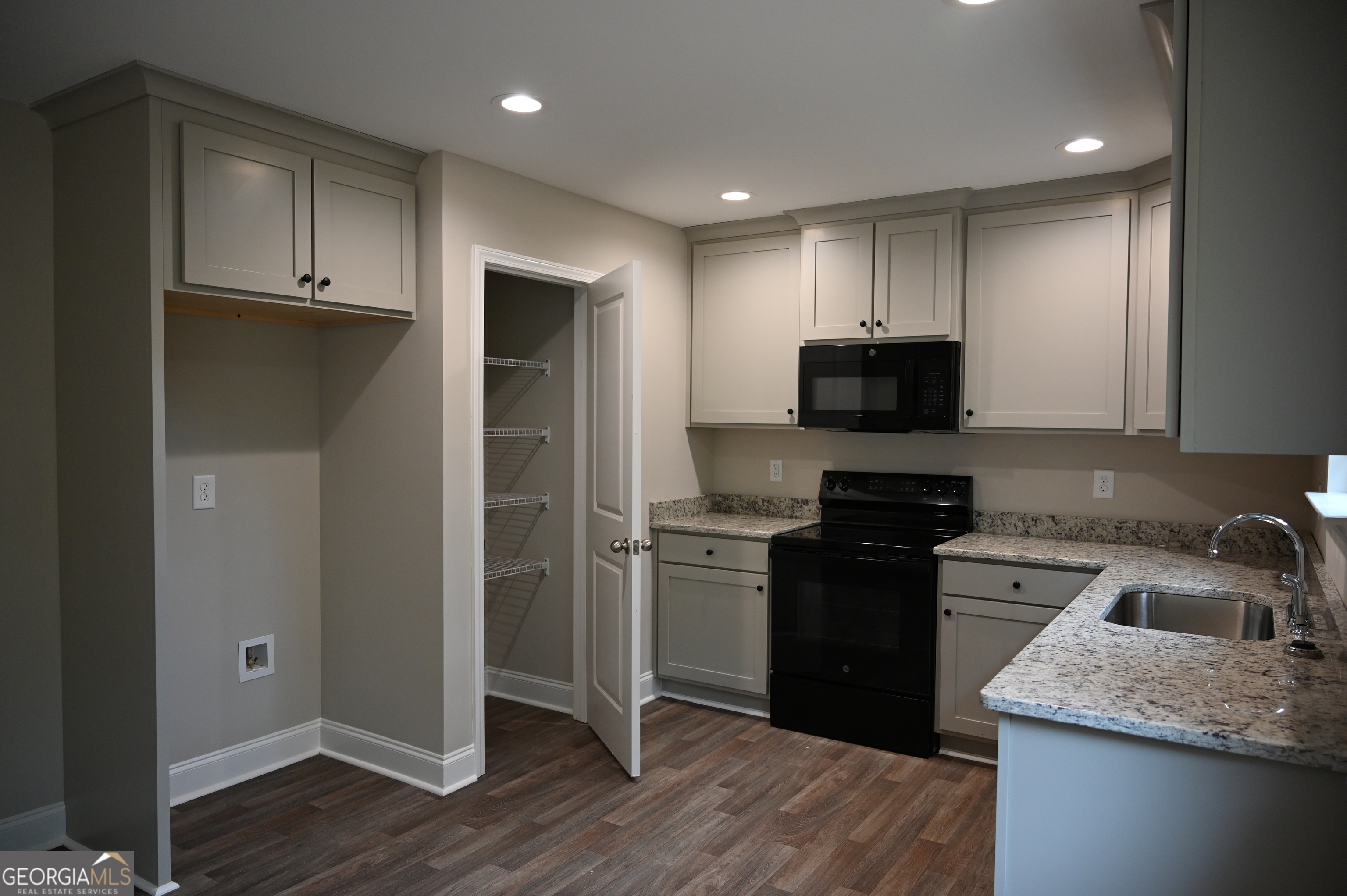 2994 Cannon Bridge Road Demorest, GA 30535 - Photo 9 of 36 a kitchen with a sink a stove and refrigerator