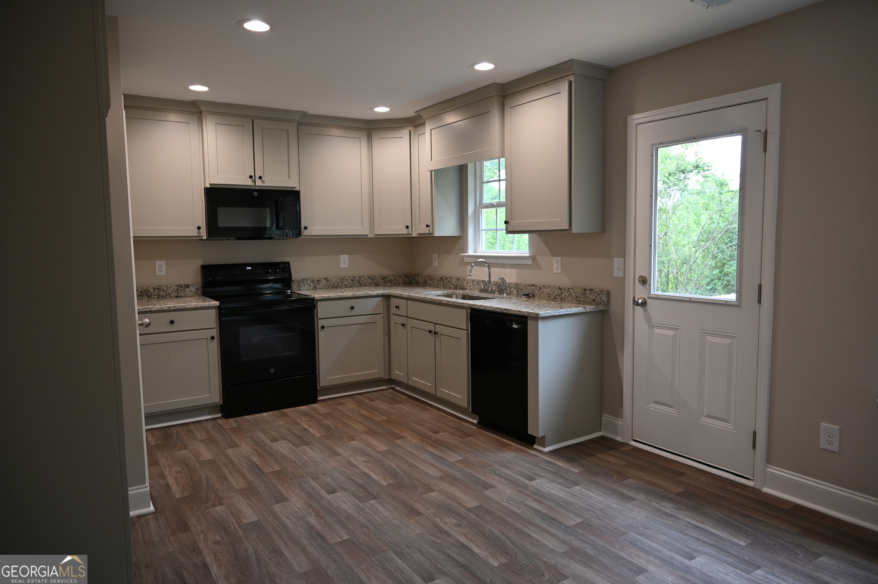 2994 Cannon Bridge Road Demorest, GA 30535 - Photo 10 of 36 a kitchen with a sink stove and microwave