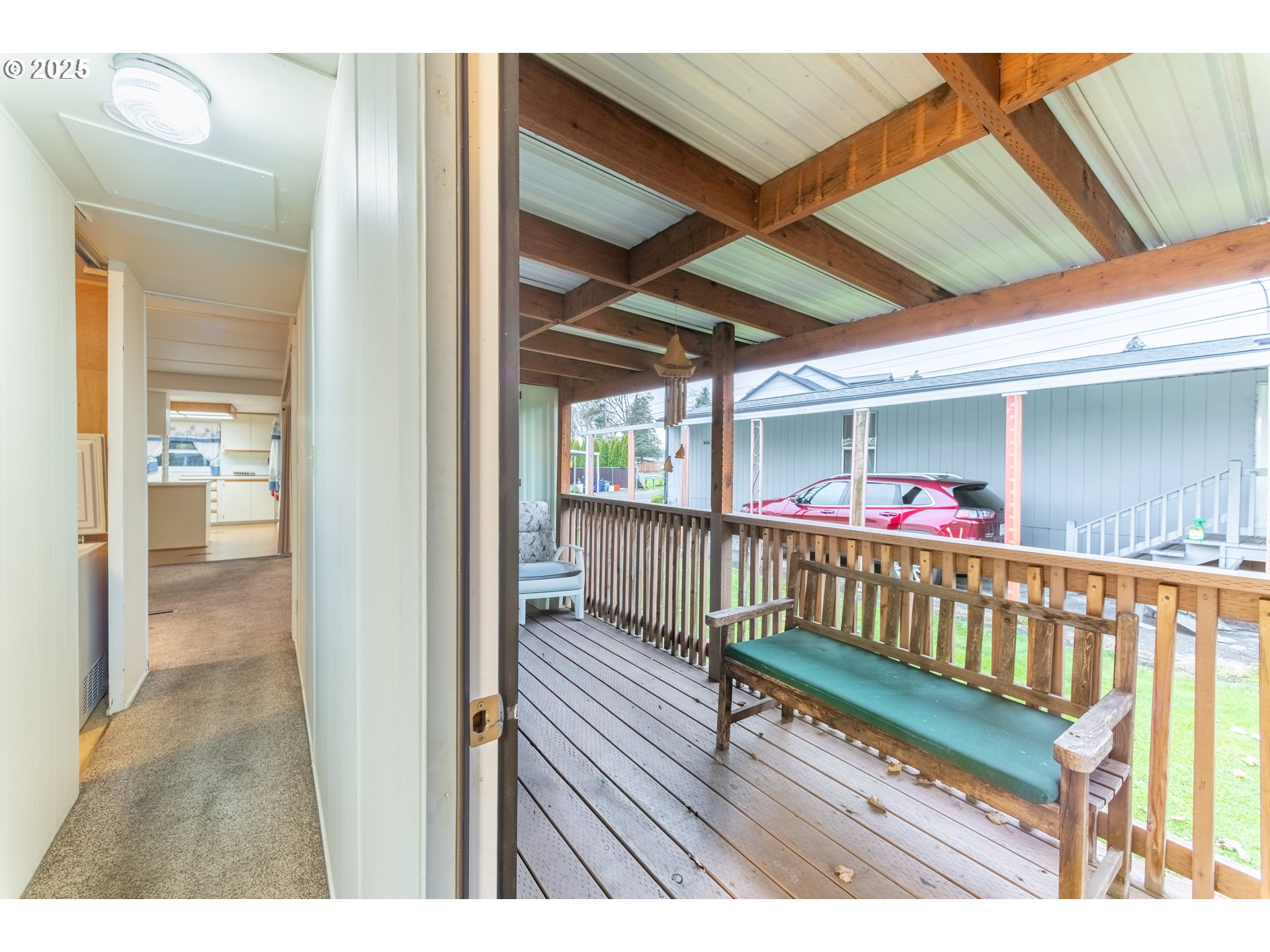 3500 Southeast Concord Road, Unit 65 Milwaukie, OR 97267 - Photo 15 of 19 a view of a porch with wooden floor