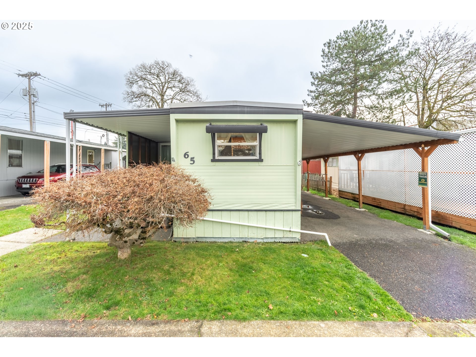3500 Southeast Concord Road, Unit 65 Milwaukie, OR 97267 - Photo 16 of 19 a front view of a house with a yard