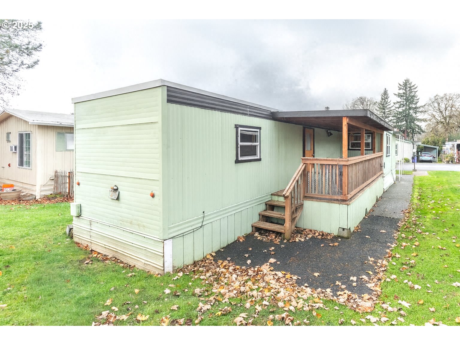 3500 Southeast Concord Road, Unit 65 Milwaukie, OR 97267 - Photo 19 of 19 a view of a house with a yard