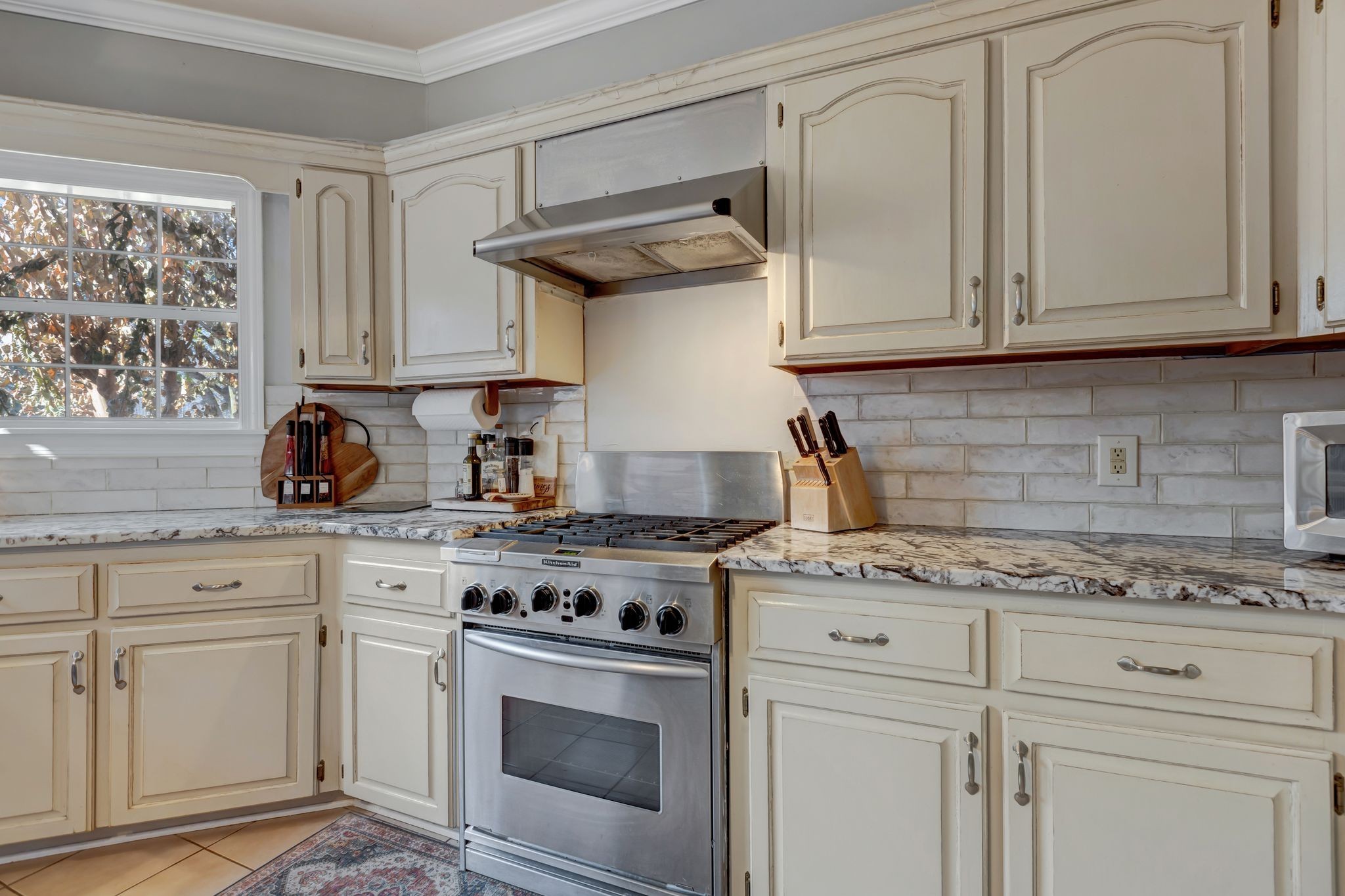 6353 Gordon Lawrence Road Santa Fe, TN 38482 - Photo 7 of 29 a kitchen with white cabinets and appliances