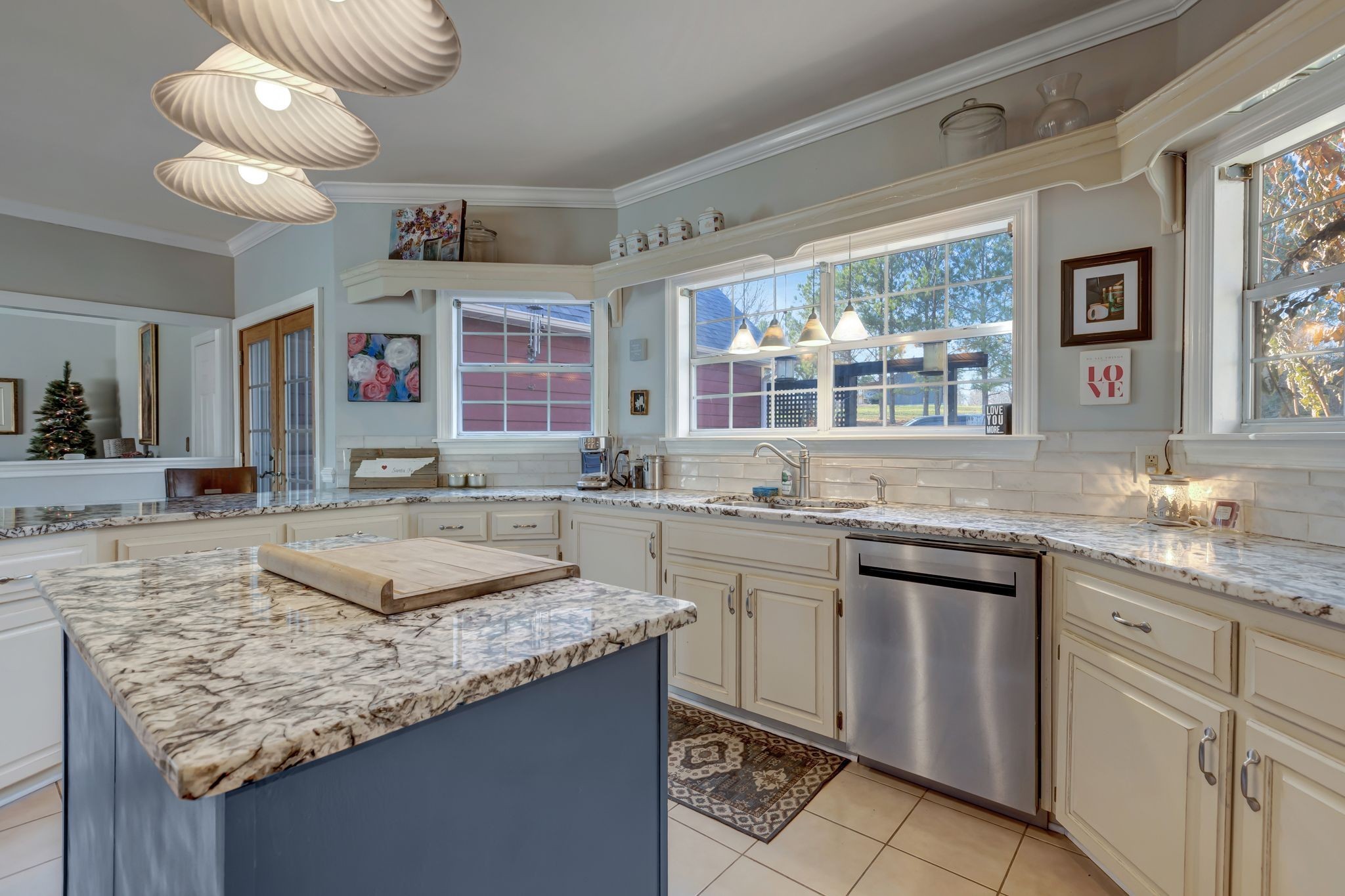 6353 Gordon Lawrence Road Santa Fe, TN 38482 - Photo 10 of 29 a kitchen with granite countertop kitchen island stainless steel appliances a sink stove and cabinets