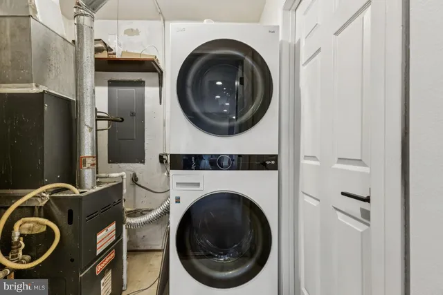 a close view of a utility room with dryer and washer