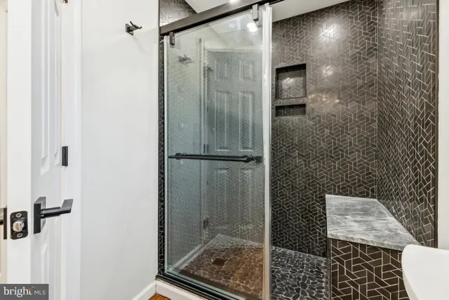 a bathroom with a shower and a toilet