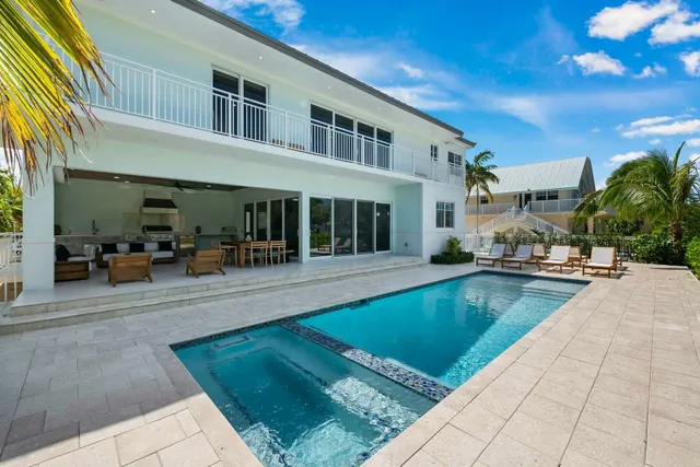 a view of swimming pool with outdoor seating