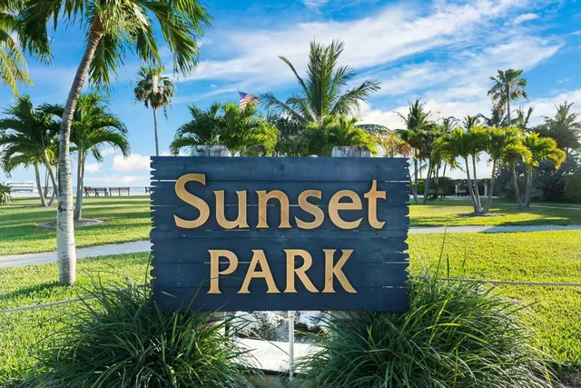 a sign that is on a brick wall