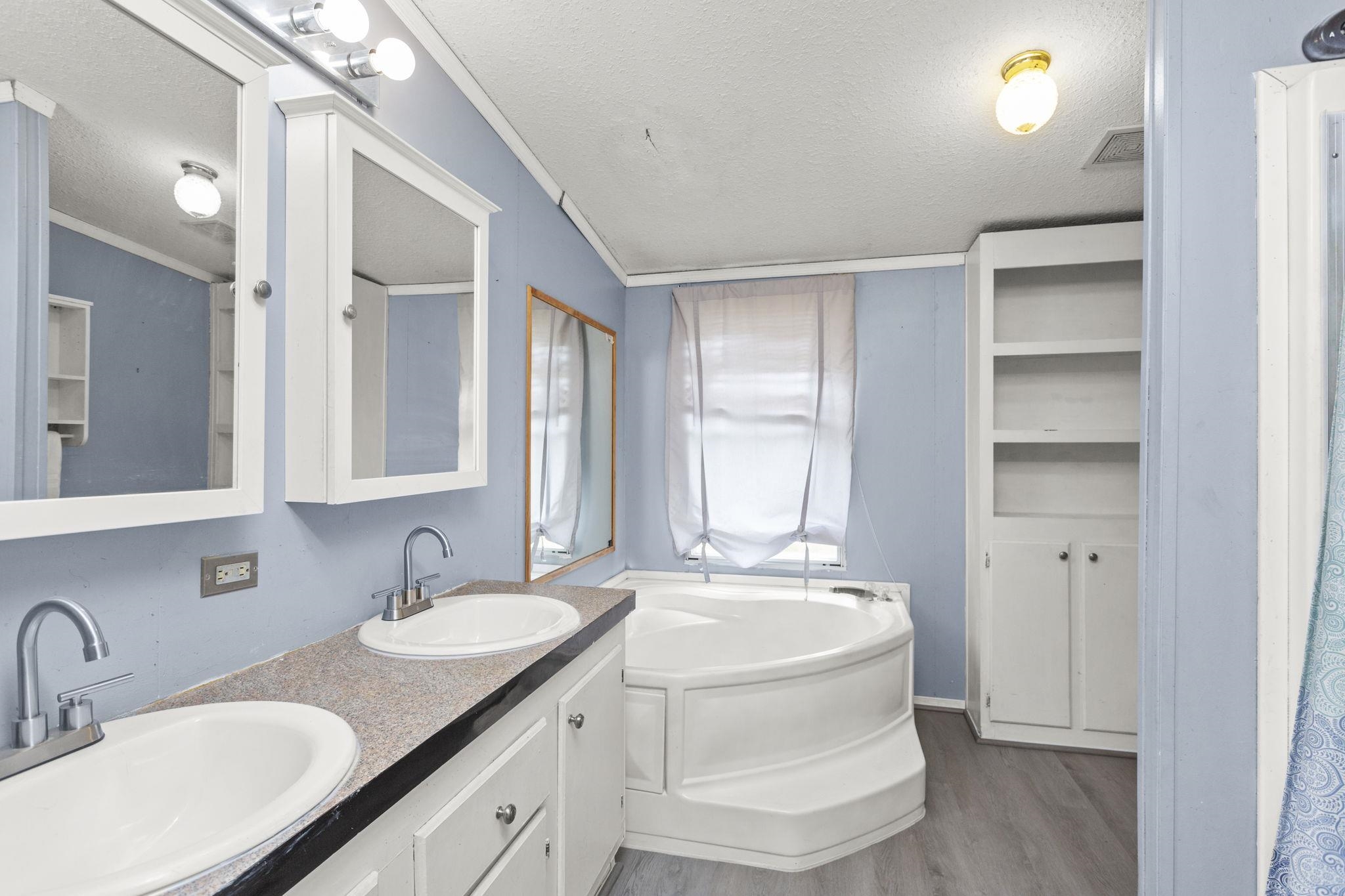 14623 Runions Creek Road Broadway, VA 22815 - Photo 13 of 30 a bathroom with a granite countertop sink and a mirror
