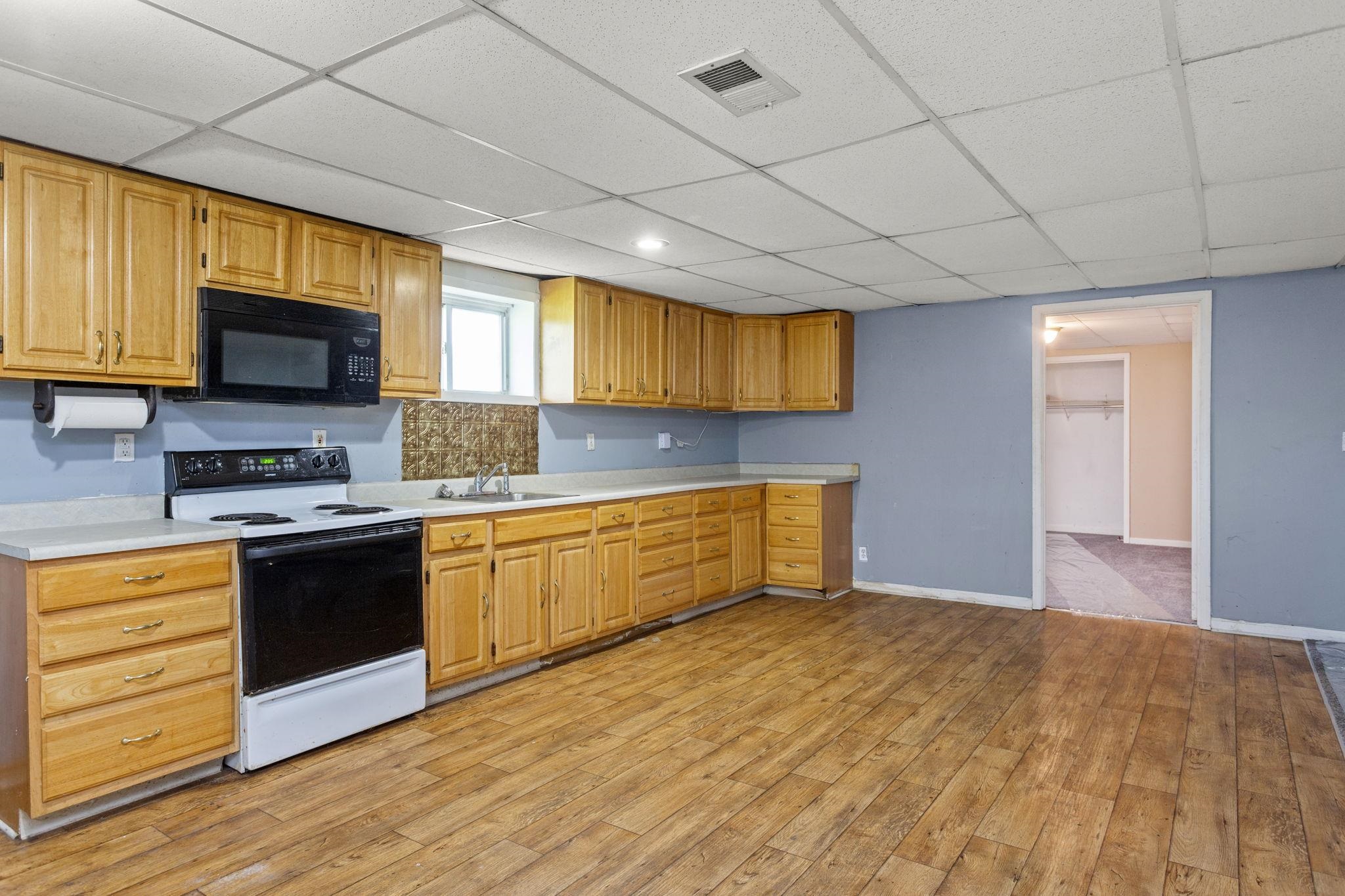 14623 Runions Creek Road Broadway, VA 22815 - Photo 18 of 30 a kitchen with stainless steel appliances granite countertop a stove a sink and a microwave