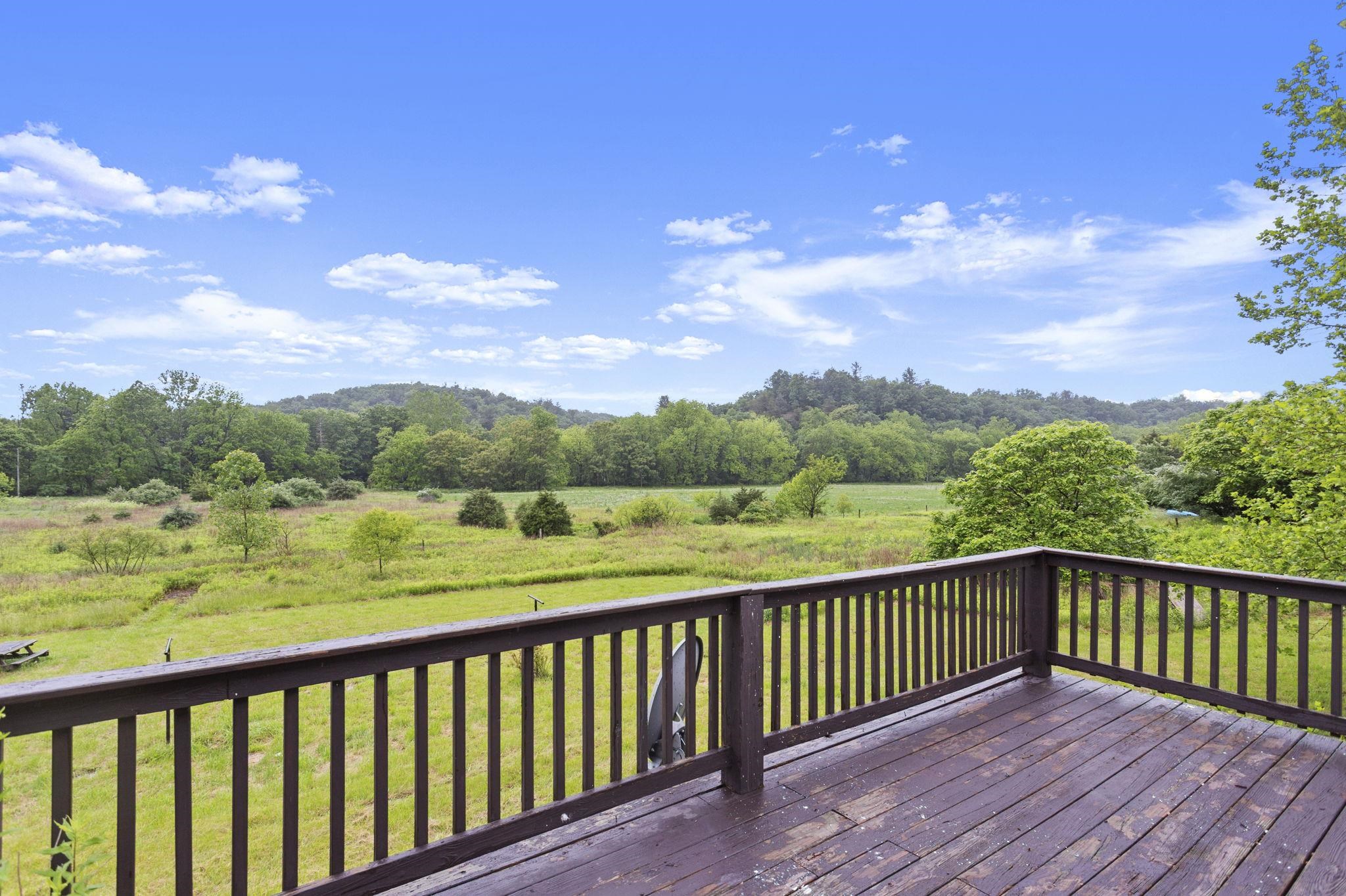 14623 Runions Creek Road Broadway, VA 22815 - Photo 26 of 30 a balcony with wooden floor and lake view
