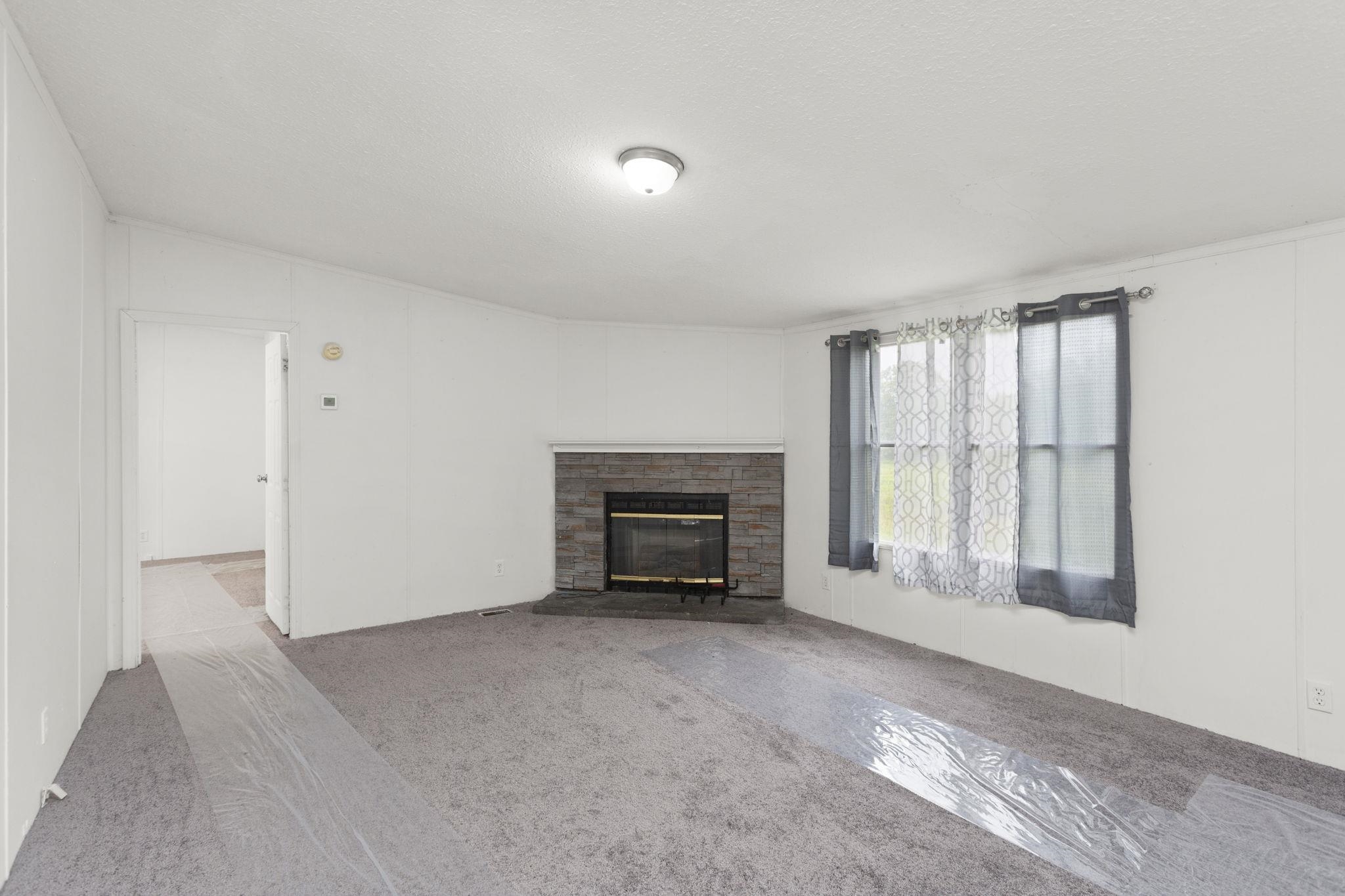 14623 Runions Creek Road Broadway, VA 22815 - Photo 5 of 30 a view of livingroom with furniture and a fireplace