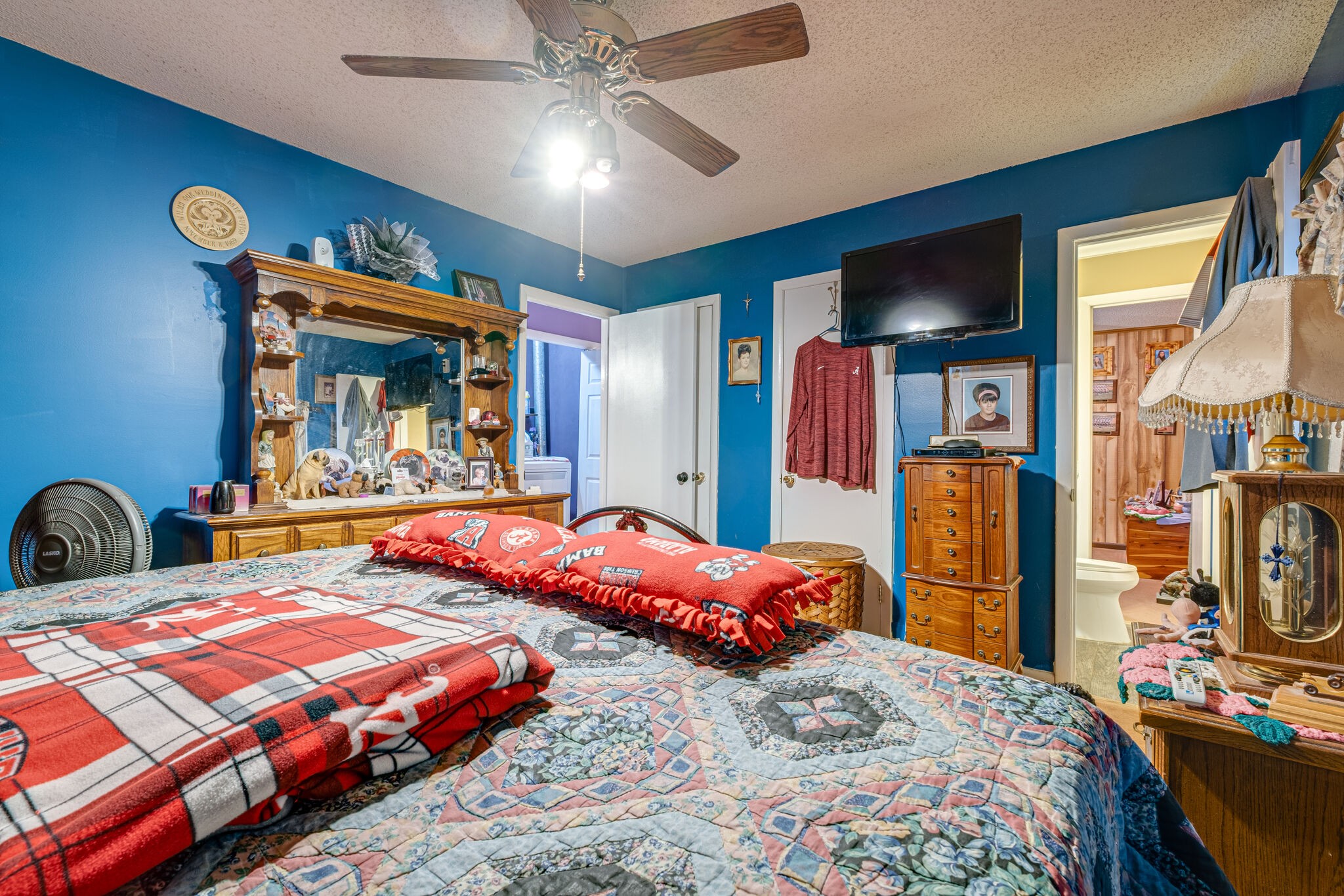 4840 Concord Drive Hermitage, TN 37076 - Photo 14 of 34 a bedroom with two beds and a chandelier