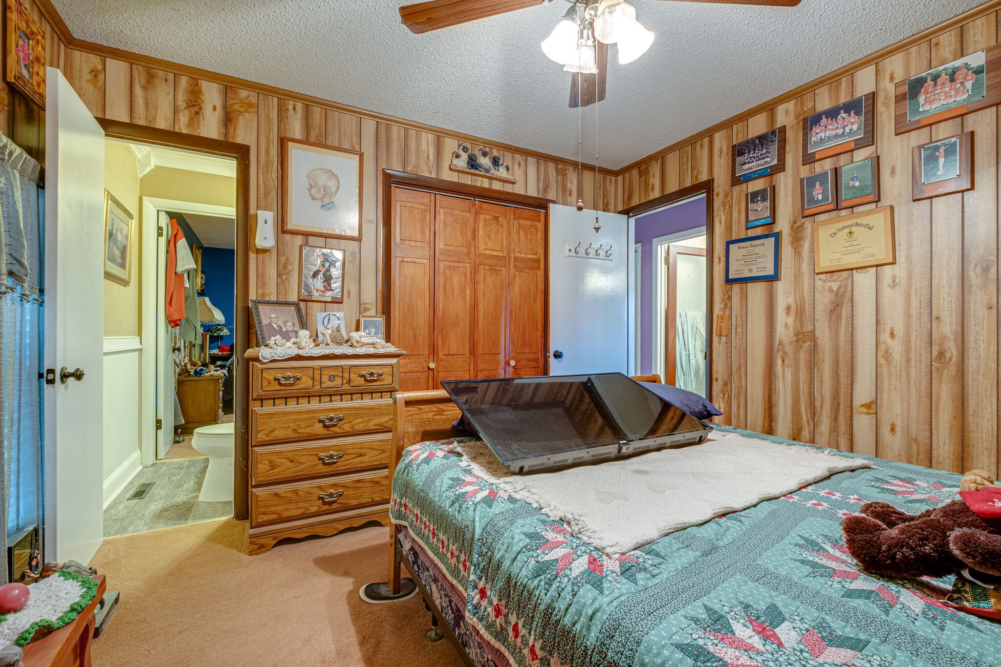 4840 Concord Drive Hermitage, TN 37076 - Photo 17 of 34 a bedroom with a bed and a chandelier