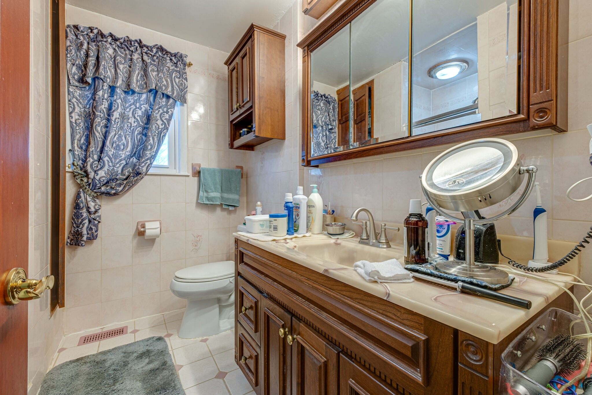 4840 Concord Drive Hermitage, TN 37076 - Photo 18 of 34 a bathroom with a sink a toilet and a mirror