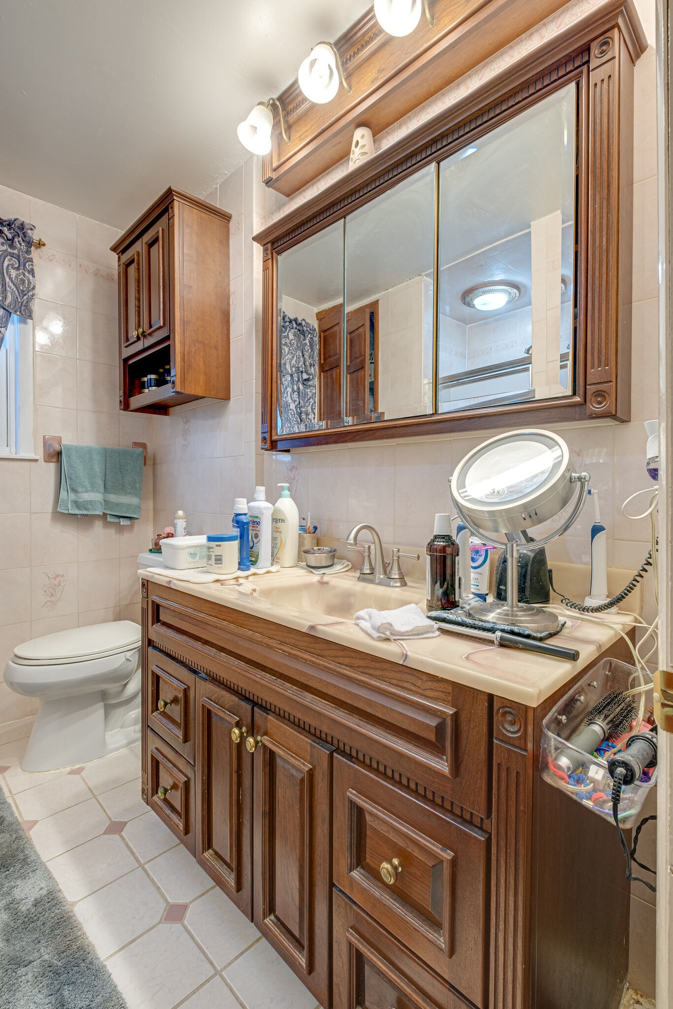4840 Concord Drive Hermitage, TN 37076 - Photo 19 of 34 a bathroom with a granite countertop sink a toilet and mirror