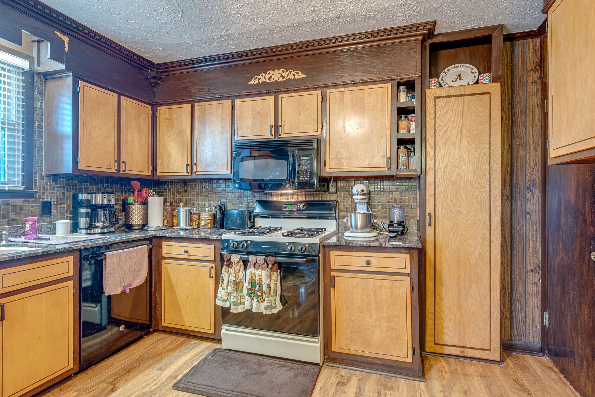 4840 Concord Drive Hermitage, TN 37076 - Photo 4 of 34 a kitchen with stainless steel appliances granite countertop a stove a sink and a refrigerator
