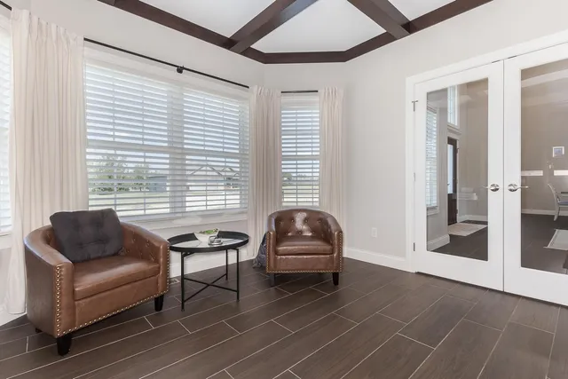a white bath tub sitting next to a shower