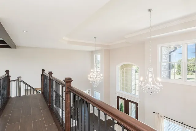 a room with pool table and window