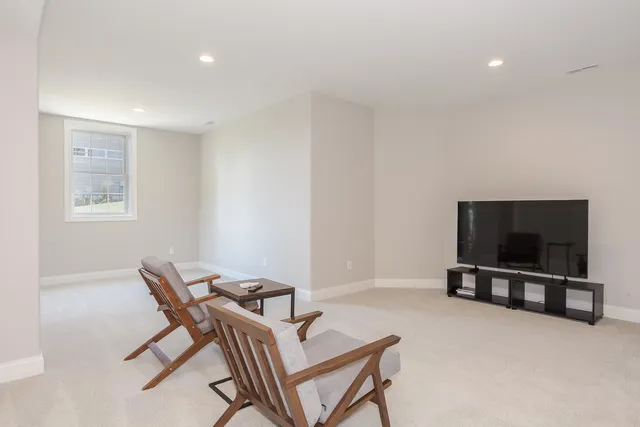 a bathroom with a granite countertop sink toilet a shower and a mirror