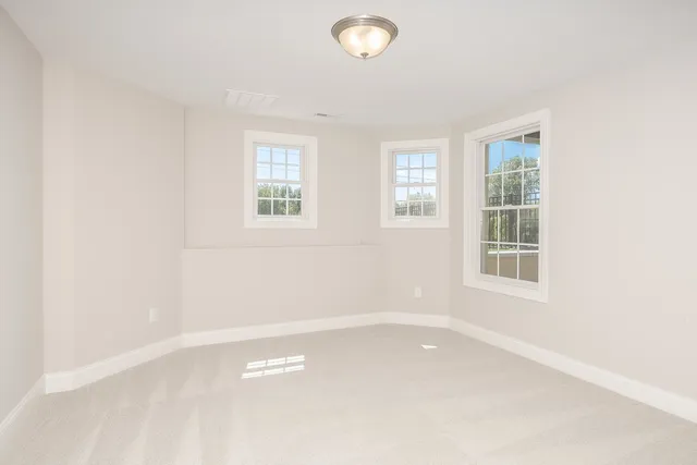 a view of balcony with wooden floor and outdoor seating
