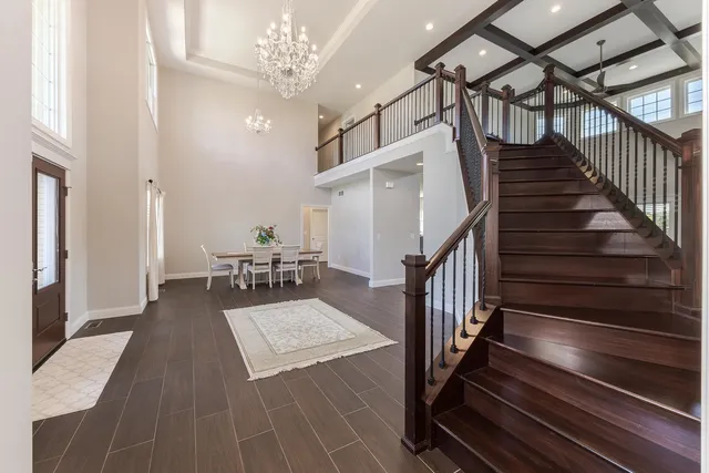a dining room with furniture and wooden floor