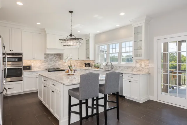 a kitchen with sink cabinets and window