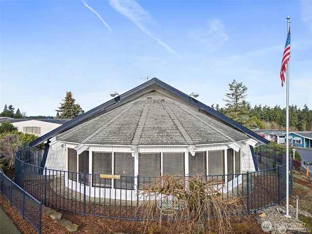 a view of a dining room with furniture wooden floor and chandelier
